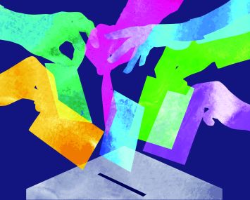 Several hands in several different colors casting a ballot.
