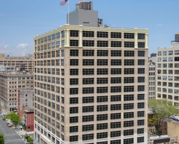 The exterior of the 15-story office building at 250 Hudson.