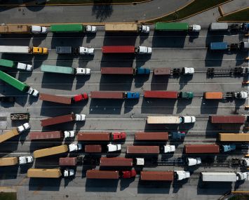 Trucks transport cargo containers