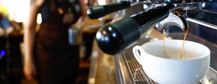 A worker prepares a coffee at Colombian coffee shop in New York City.